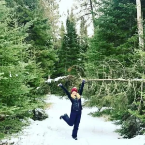 Dancing and holding tree in forest